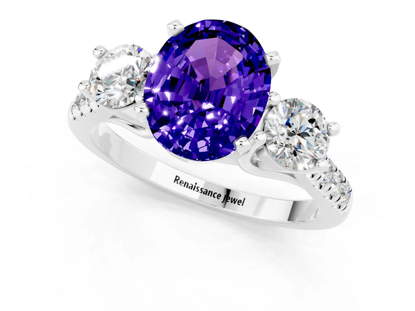 Platinum Three-Stone Oval Cut Tanzanite Pavé Band with Four-Prong Setting