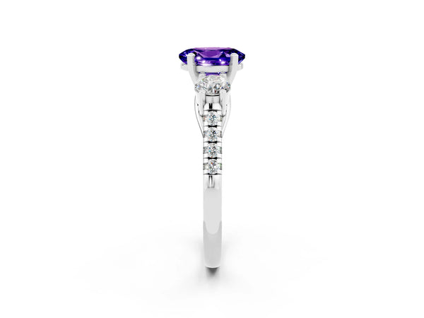 Platinum Three-Stone Oval Cut Tanzanite Pavé Band with Four-Prong Setting