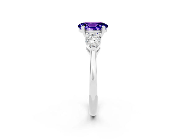 White gold Three-Stone Oval Cut Tanzanite Ring with Pear Side Stones and Four-Prong Setting