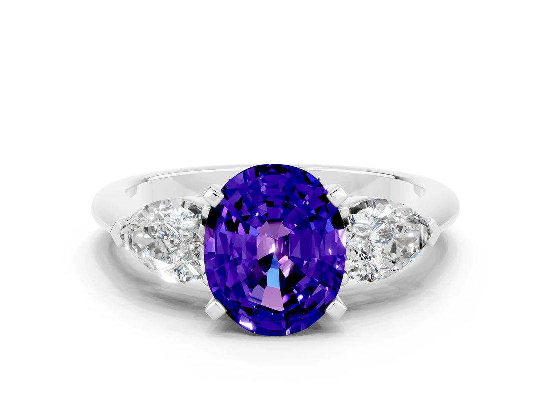 White gold Three-Stone Oval Cut Tanzanite Ring with Pear Side Stones and Four-Prong Setting