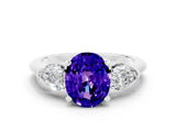 White gold Three-Stone Oval Cut Tanzanite Ring with Pear Side Stones and Four-Prong Setting