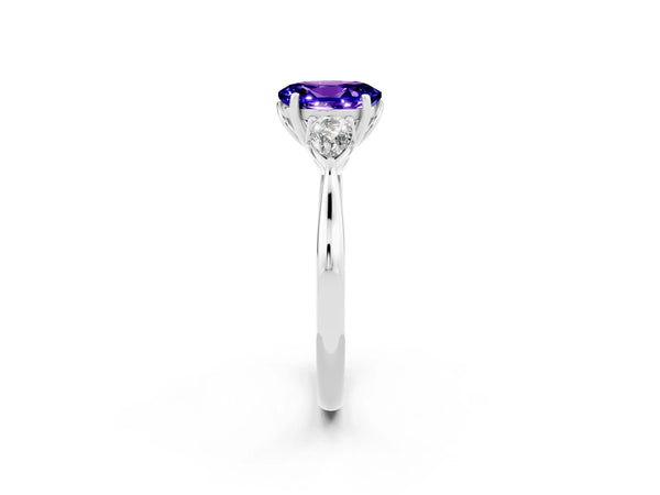 Platinum Three-Stone Oval Cut Tanzanite Ring with Pear  Side Stones in Four-Prong Setting