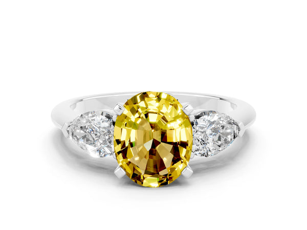 Platinum Three-Stone Oval Cut Yellow Sapphire Ring with Pear Side Stones and Four-Prong Setting