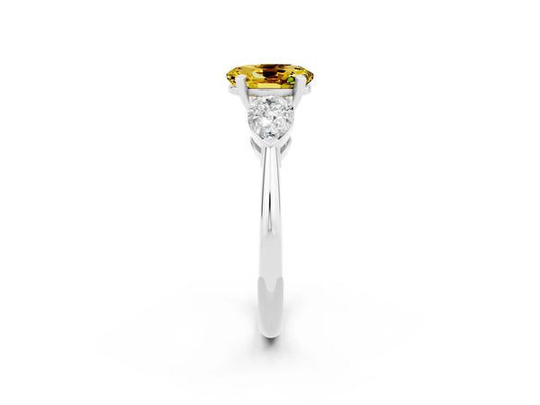 Platinum Three-Stone Oval Cut Yellow Sapphire Ring with Pear Side Stones and Four-Prong Setting