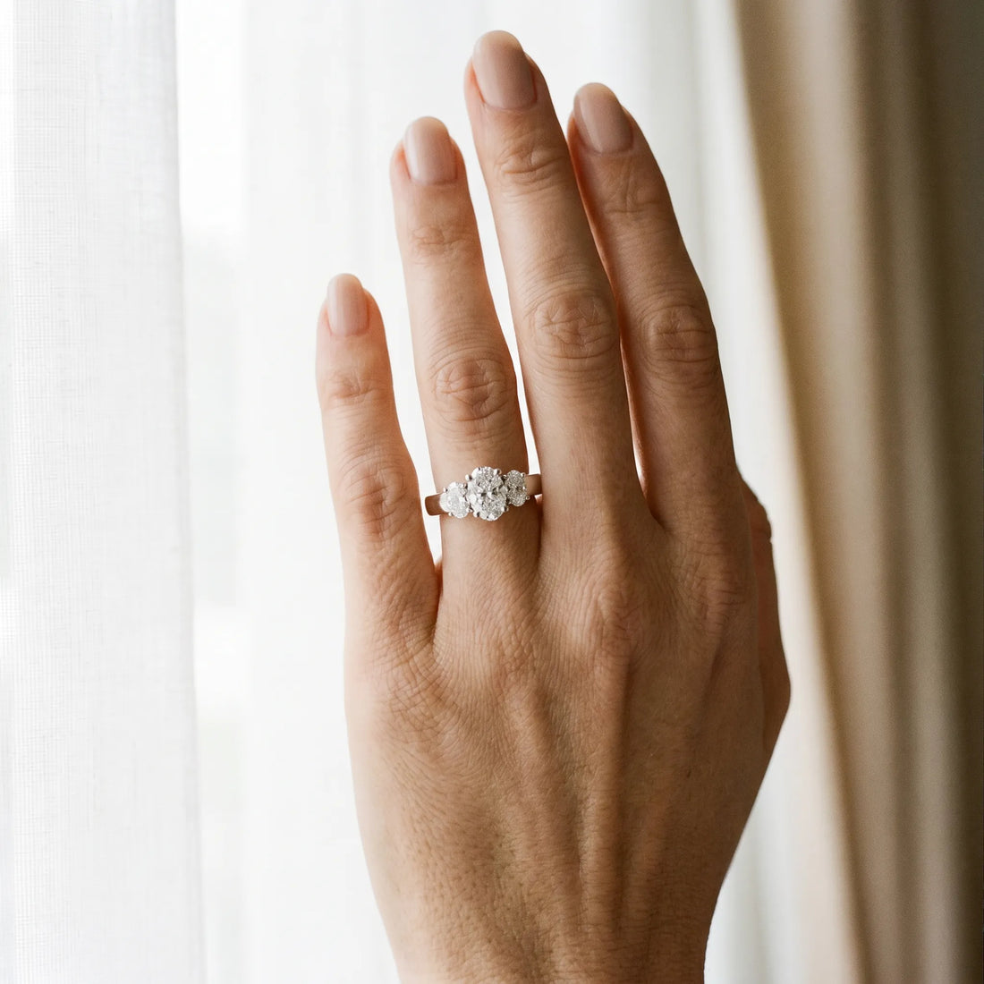 White gold Three-Stone Oval Diamond Ring with Channel Band and Prong Setting_22