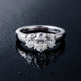 White gold Three-Stone Oval Diamond Ring with Channel Band and Prong Setting_25