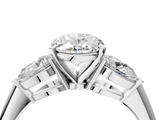 White gold Three-Stone Oval Diamond Ring with Pear Side Stones in Four-Prong Setting_90