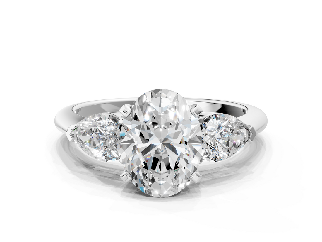 White gold Three-Stone Oval Diamond Ring with Pear Side Stones in Four-Prong Setting_90