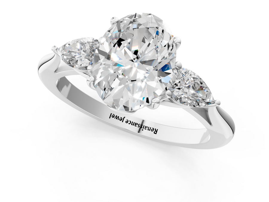 White gold Three-Stone Oval Diamond Solitaire Ring with Pear Side Stones and Four-Prong Setting