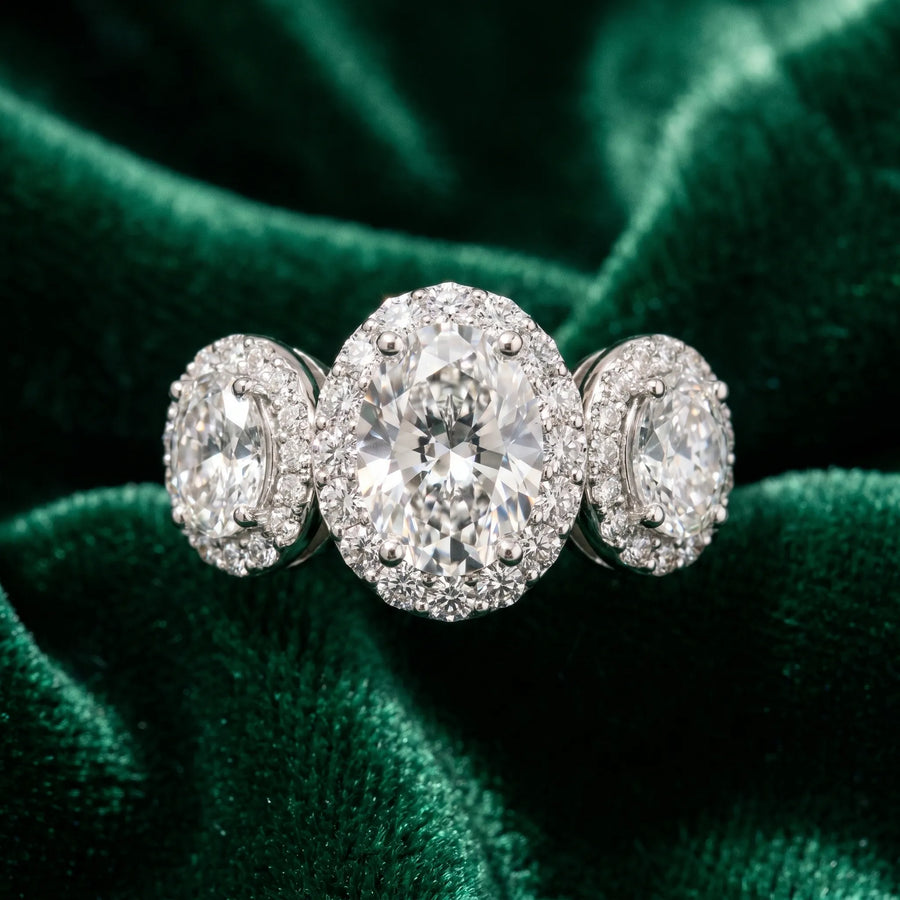 White gold Three-Stone Oval Halo Diamond Ring with Pave Band and Four-Prong Setting
