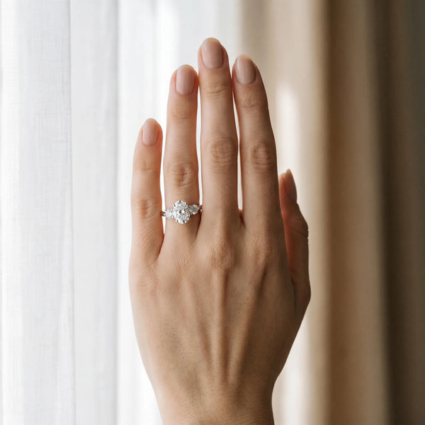 White gold Three-Stone Oval Solitaire Ring with Tapered Band and Four-Prong Setting