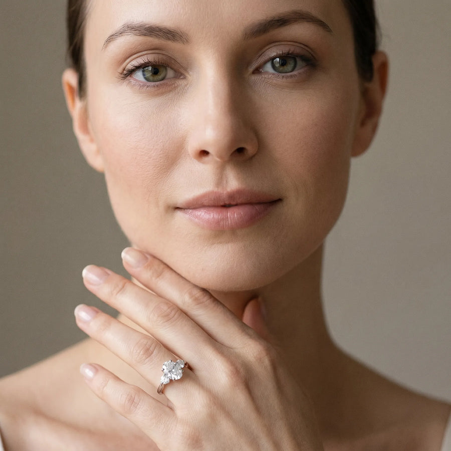 White gold Three-Stone Oval Solitaire Ring with Tapered Band and Four-Prong Setting