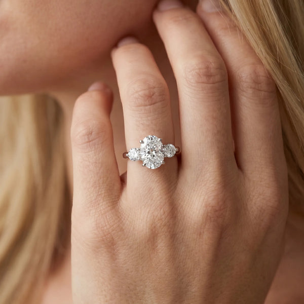 White gold Three-Stone Oval Solitaire Ring with Tapered Band and Four-Prong Setting