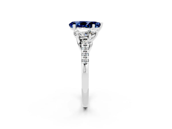 Silver Three-Stone Pear Cut Blue Sapphire Ring with Round  Pavé Band and Prong Setting