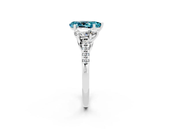 Platinum Three-Stone Pear Cut Blue Topaz Ring with Round  Pavé Band and Prong Setting