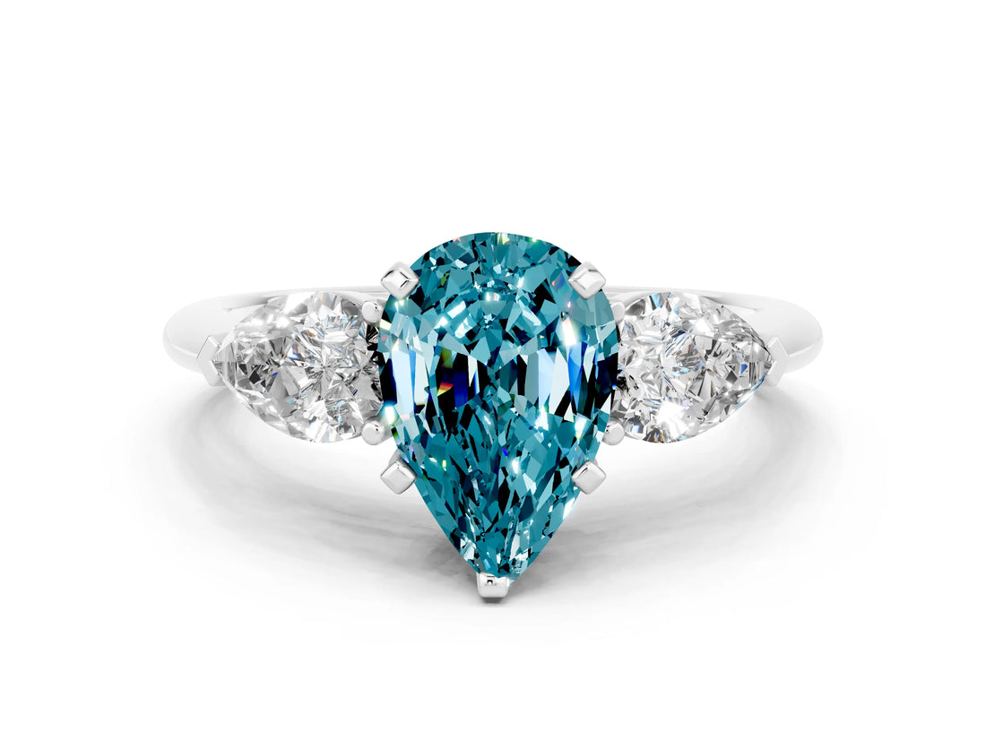 White gold Three-Stone Pear Cut Blue Topaz Ring with Pear Side Stones and Four-Prong Setting