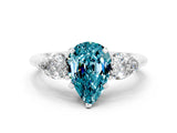 White gold Three-Stone Pear Cut Blue Topaz Ring with Pear Side Stones and Four-Prong Setting