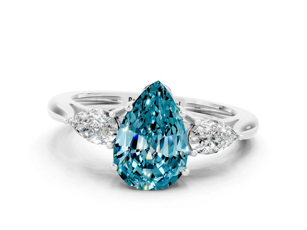 Platinum Three-Stone Pear Cut Blue Topaz Ring with Pear  Side Stones in Four-Prong Setting