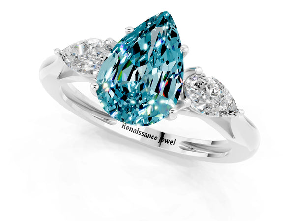 Platinum Three-Stone Pear Cut Blue Topaz Ring with Pear  Side Stones in Four-Prong Setting