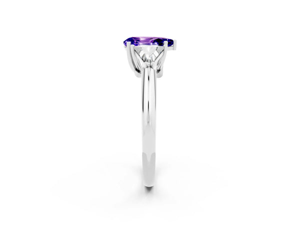 White gold Three-Stone Pear Cut Tanzanite Engagement Ring with Trillion Side Stones and Prong Setting