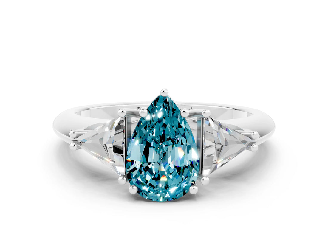 White gold Three-Stone Pear Cut Cut Diamond Ring with Trillion Side Stones and Four-Prong Setting