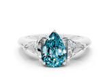 White gold Three-Stone Pear Cut Cut Diamond Ring with Trillion Side Stones and Four-Prong Setting