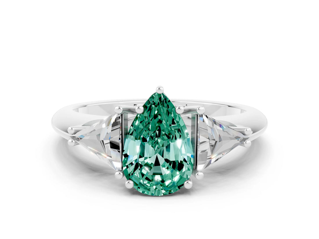 White gold Three-Stone Pear Cut Cut Diamond Ring with Trillion Side Stones and Four-Prong Setting