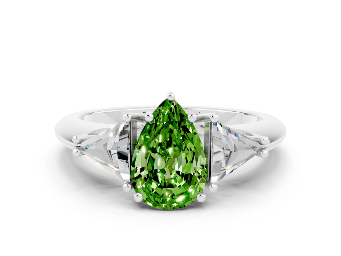 White gold Three-Stone Pear Cut Cut Diamond Ring with Trillion Side Stones and Four-Prong Setting