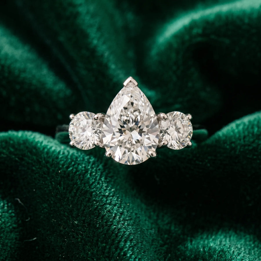 White gold Three-Stone Pear Cut Diamond Engagement Ring with Prong Setting on a White Gold Band