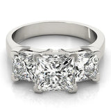 White gold Three-Stone Pear Cut Diamond Ring with Channel Set Band and Four-Prong Setting 1