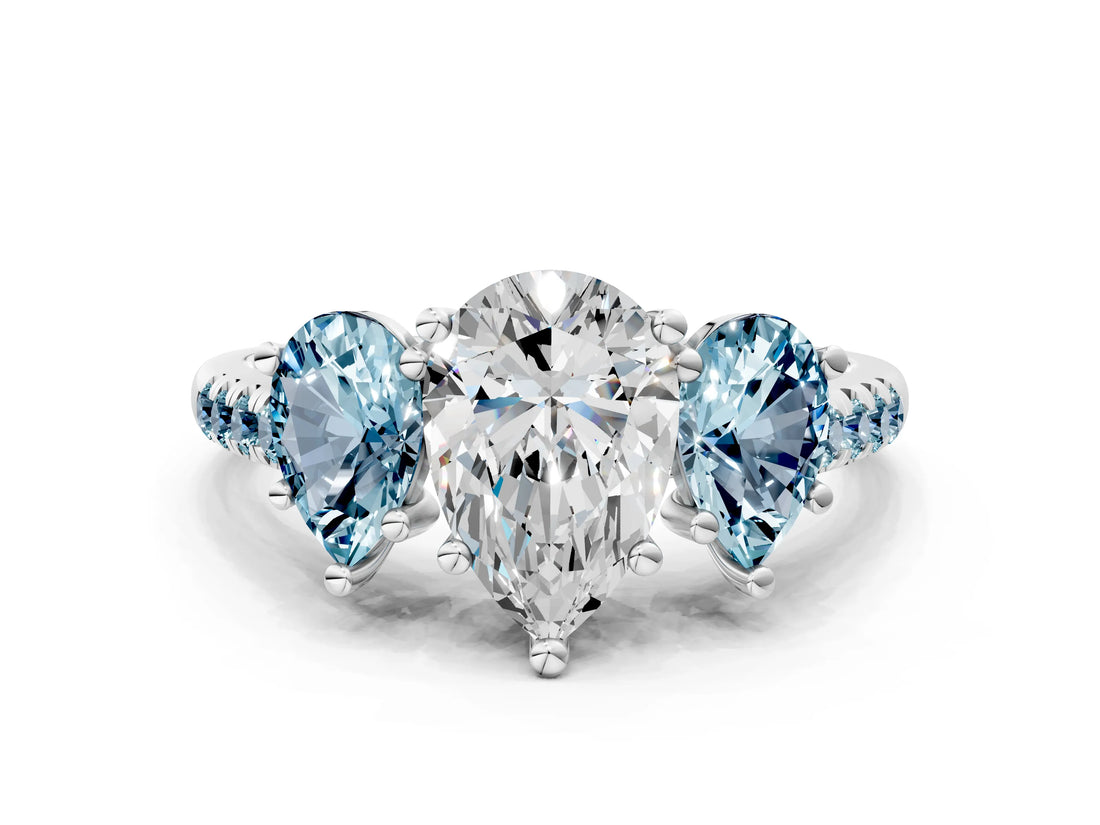 White gold Three-Stone Pear Cut Diamond Ring with Round with Aquamarine side stone Pavé Band and Prong Setting