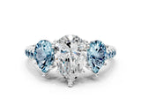 White gold Three-Stone Pear Cut Diamond Ring with Round with Aquamarine side stone Pavé Band and Prong Setting