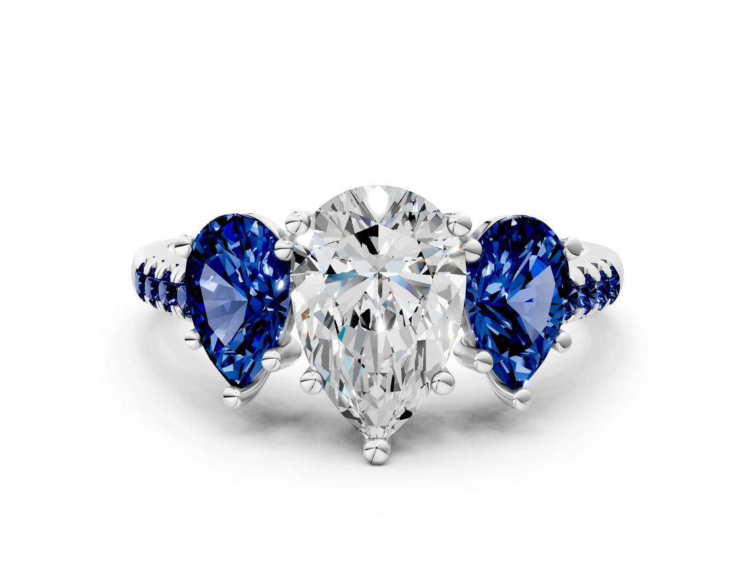 White gold Three-Stone Pear Cut Diamond Ring with Round with Blue Sapphire side stone Pavé Band and Prong Setting_12