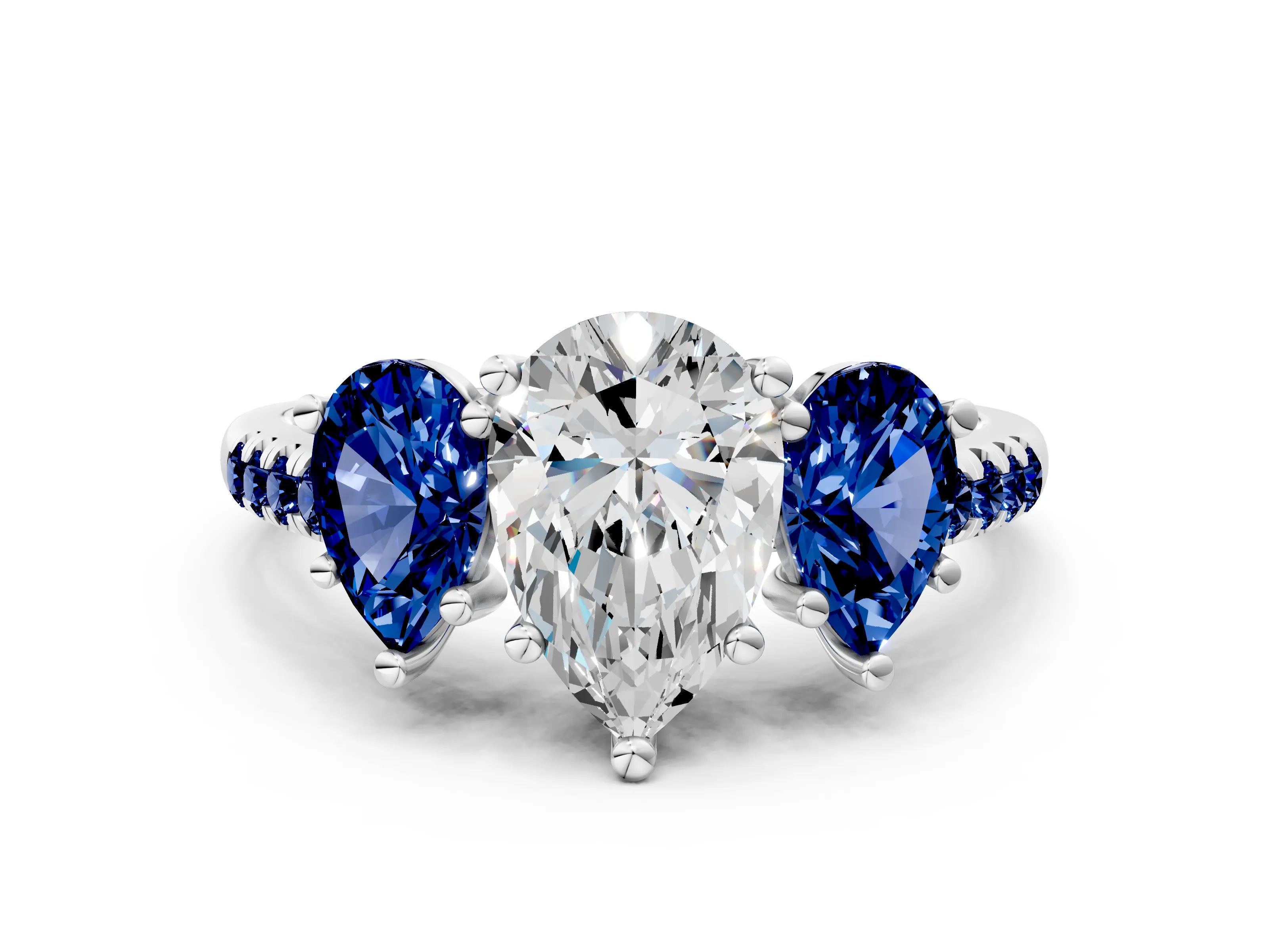 White gold Three-Stone Pear Cut Diamond Ring with Round with Blue Sapphire side stone Pavé Band and Prong Setting