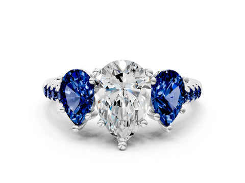 White gold Three-Stone Pear Cut Diamond Ring with Round with Blue Sapphire side stone Pavé Band and Prong Setting