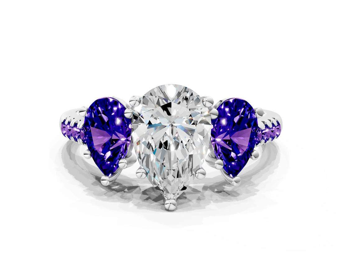 White gold Three-Stone Pear Cut Diamond Ring with Round with Tanzanite side stone Pavé Band and Prong Setting