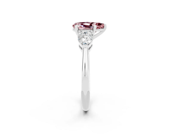 Platinum Three-Stone Pear Cut Morganite Ring with Pear Side Stones and Four-Prong Setting