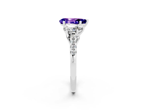 Platinum Three-Stone Pear Cut Tanzanite Ring with Round  Pavé Band and Prong Setting