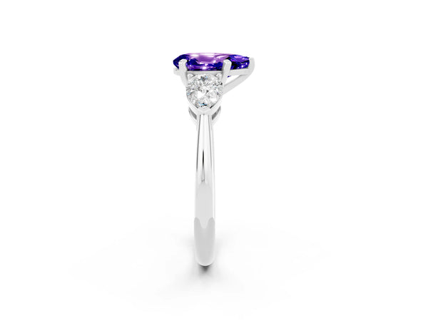 Platinum Three-Stone Pear Cut Tanzanite Ring with Pear Side Stones and Four-Prong Setting