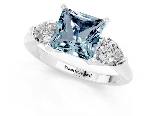 Silver Three-Stone Princess Cut Aquamarine Ring with Pear Side Stones and Four-Prong Setting