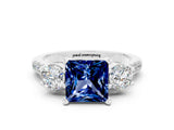 White gold Three-Stone Princess Cut Blue Sapphire Pavé Band with Four-Prong Setting