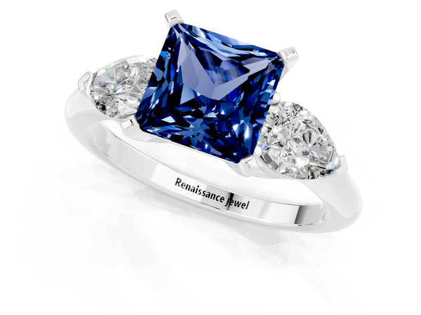 Silver Three-Stone Princess Cut Blue Sapphire Ring with Pear Side Stones and Four-Prong Setting