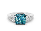 White gold Three-Stone Princess Cut Blue Topaz Ring with Pear Side Stones and Four-Prong Setting