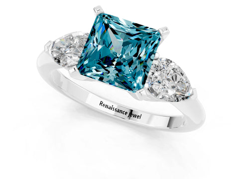 White gold Three-Stone Princess Cut Blue Topaz Ring with Pear Side Stones and Four-Prong Setting_1