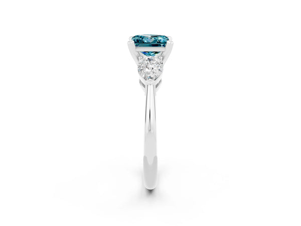 Platinum Three-Stone Princess Cut Blue Topaz Ring with Pear Side Stones and Four-Prong Setting