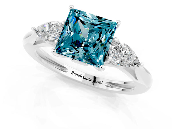 Platinum Three-Stone Princess Cut Blue Topaz Ring with Pear  Side Stones in Four-Prong Setting