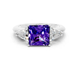 White gold Three-Stone Princess Cut Cut Diamond Ring with Trillion Side Stones and Four-Prong Setting