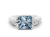 White gold Three-Stone Princess Cut Cut Diamond Ring with Trillion Side Stones and Four-Prong Setting