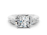 White gold Three-Stone Princess Cut Cut Diamond Ring with Trillion Side Stones and Four-Prong Setting