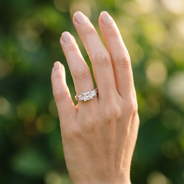 White gold Three-Stone Princess Cut Diamond Ring with Cathedral Band and Four-Prong Setting